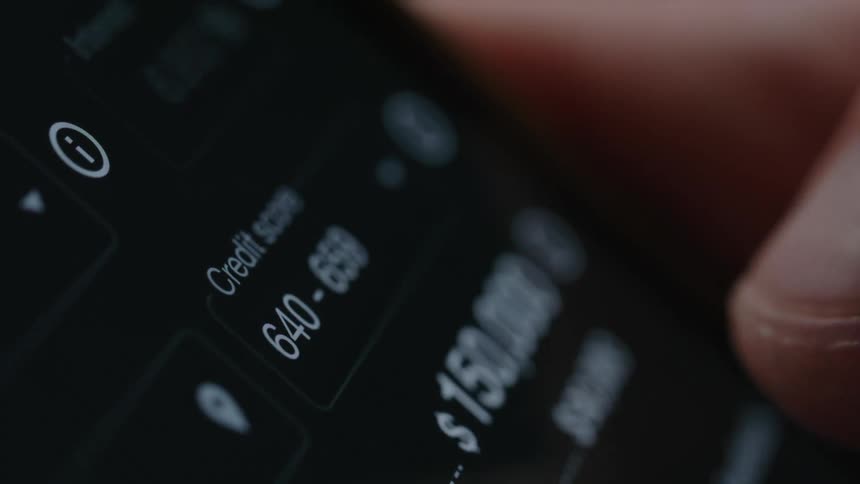 A person scrolls through financial information on a cell phone