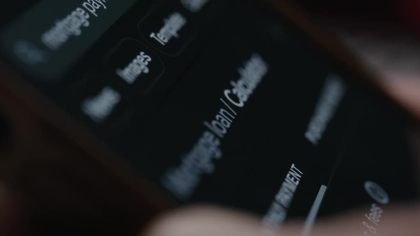 A person scrolls through their cell phone