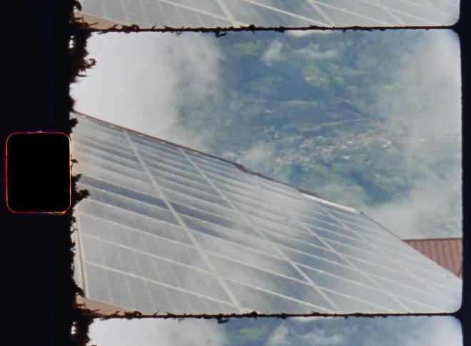 A roof with a solar panel overlooking the valley