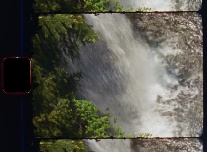 Film footage of a waterfall during spring