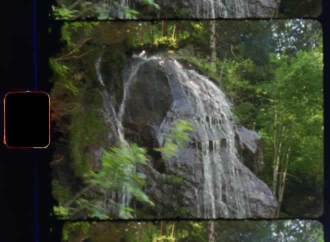 The waterfall is pouring water over the cliff