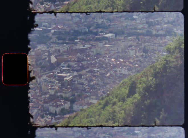 A mountain is on the side of the city