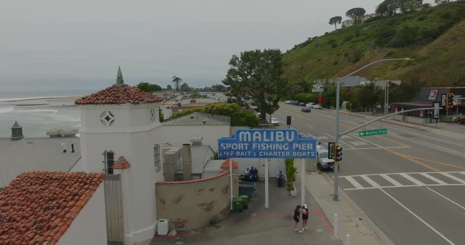 An establishing shot of the Malibu pier sign