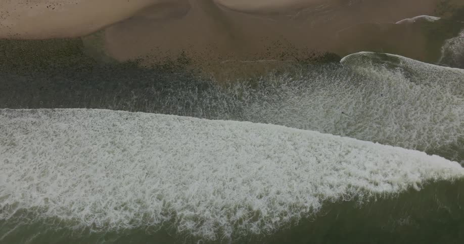 The waves crash on the shore