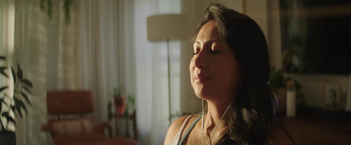 The view is of a portrait of a woman that is indoors
