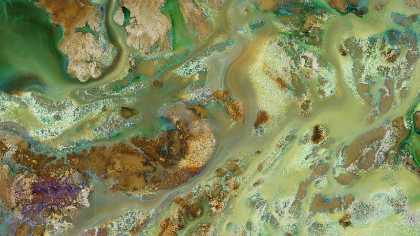 a liquid image of rivers and rocks with natural colors flowing across the screen