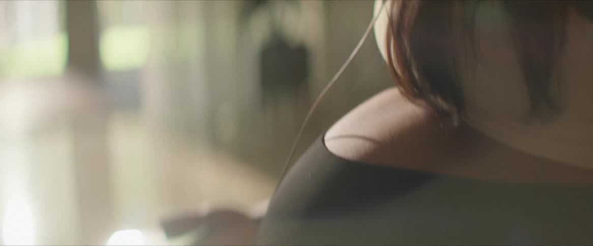 The view is of a portrait of a pregnant woman that is indoors