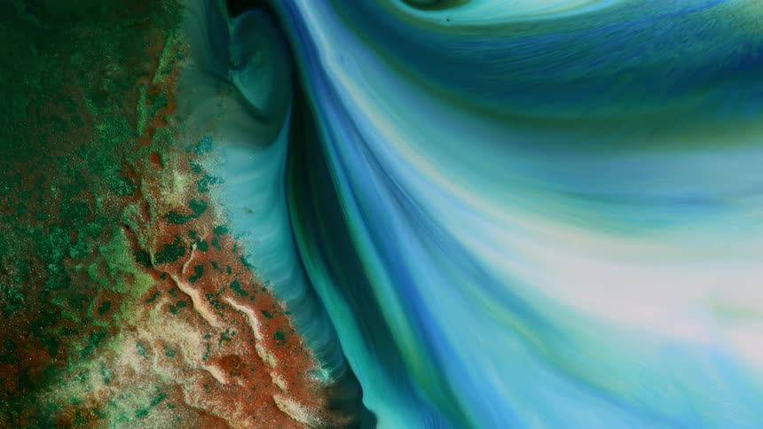 abstract liquid art image with a river of green blue and white on a shore with red rocks