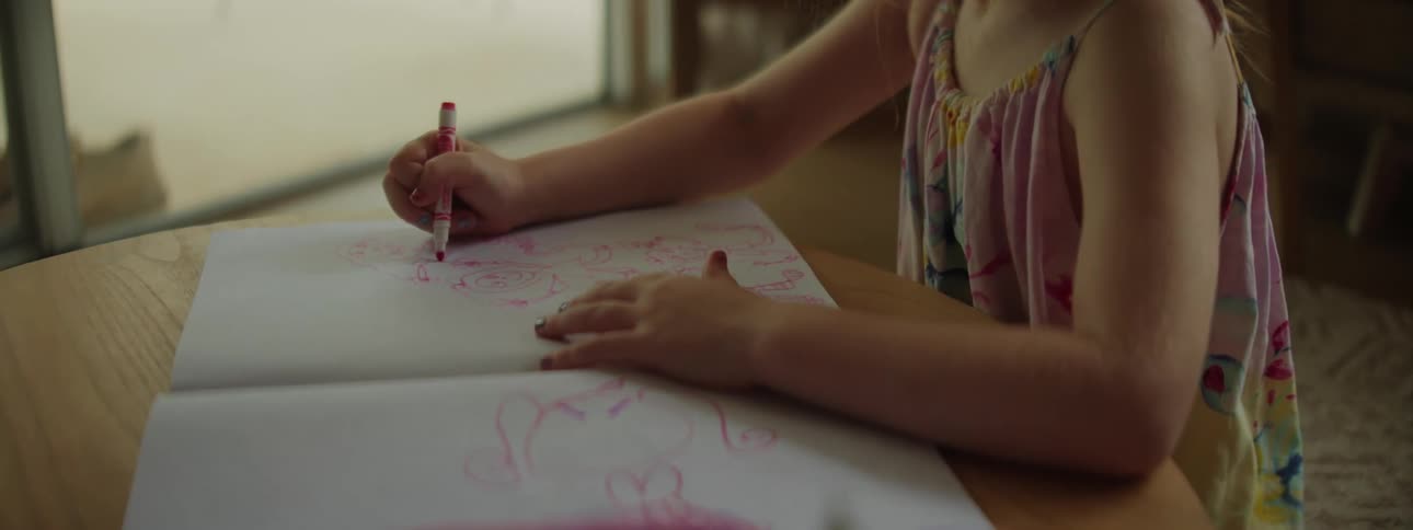 The view is of a portrait of a child that is drawing