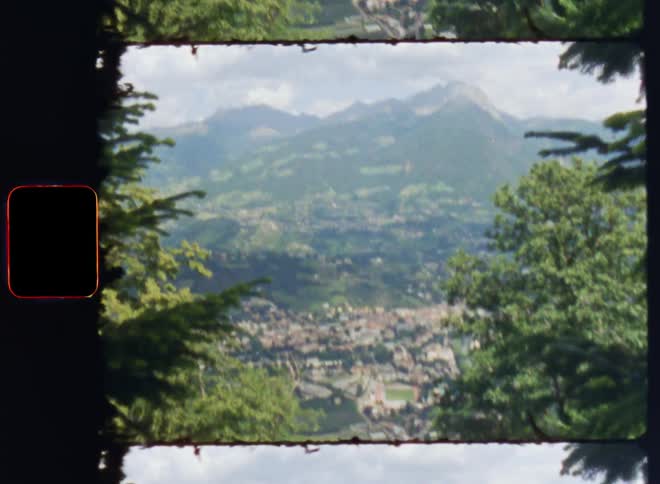 Film footage of a suburban city near the mountains