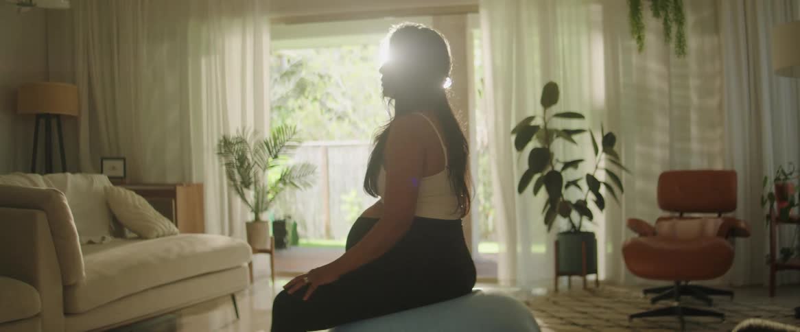 The view is of a portrait of a woman that is indoors