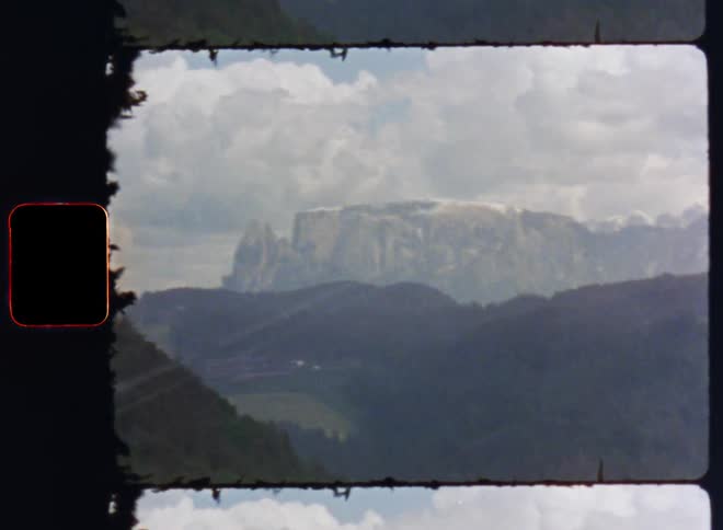 Natural landscape with a mountain range under heavy clouds