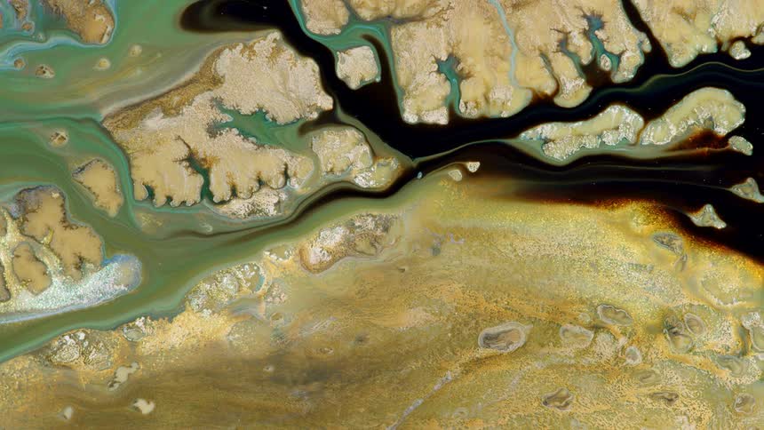 Black liquid is flowing around the yellow textured areas and over the green and blending as it becomes a dark flowing river