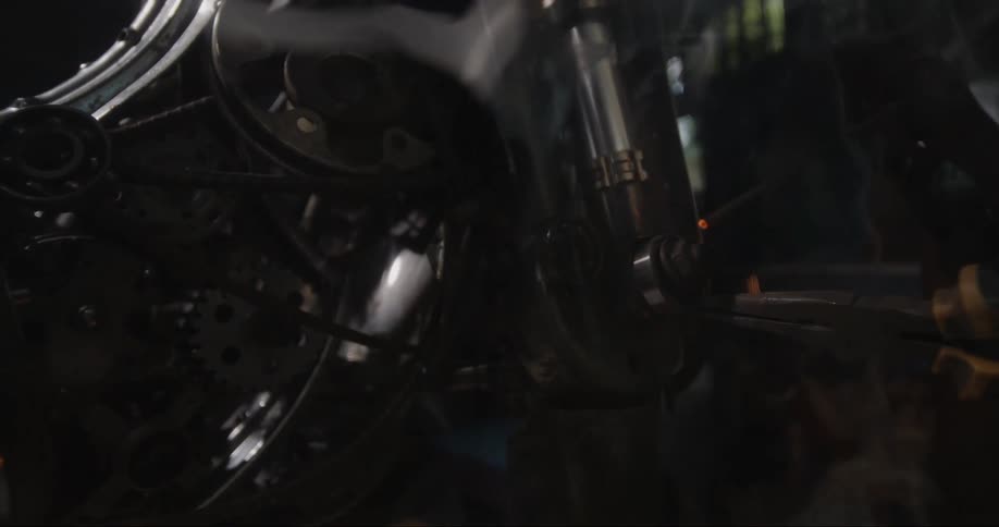 A person is welding a machine
