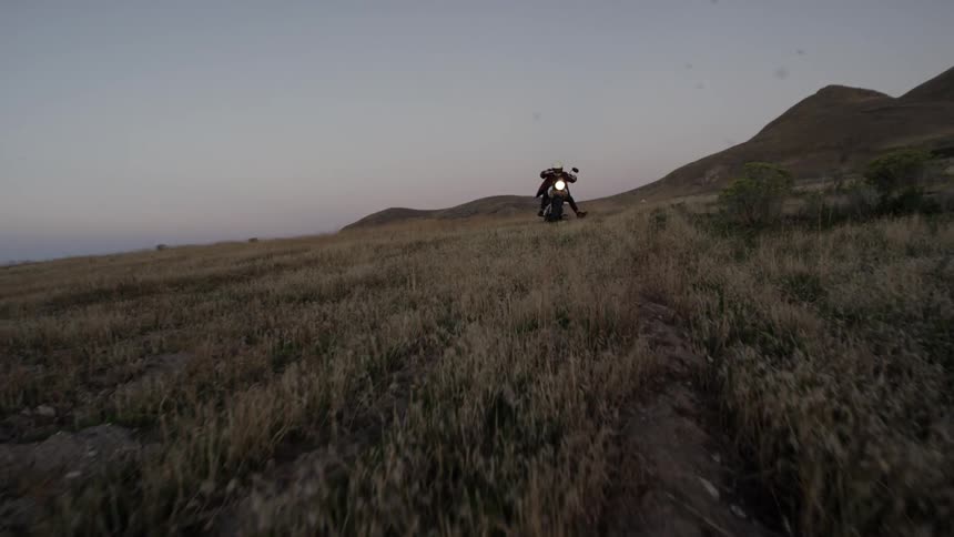A motorcyclists is riding his street bike off-road