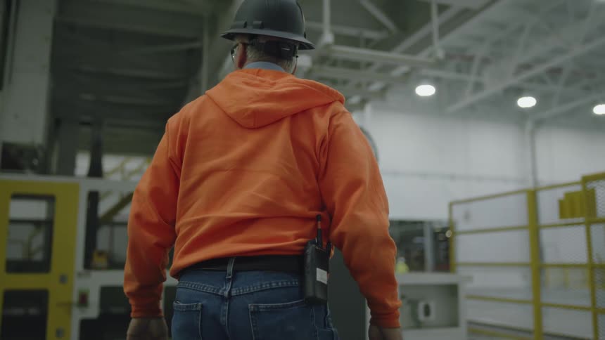 A worker walks through the warehouse