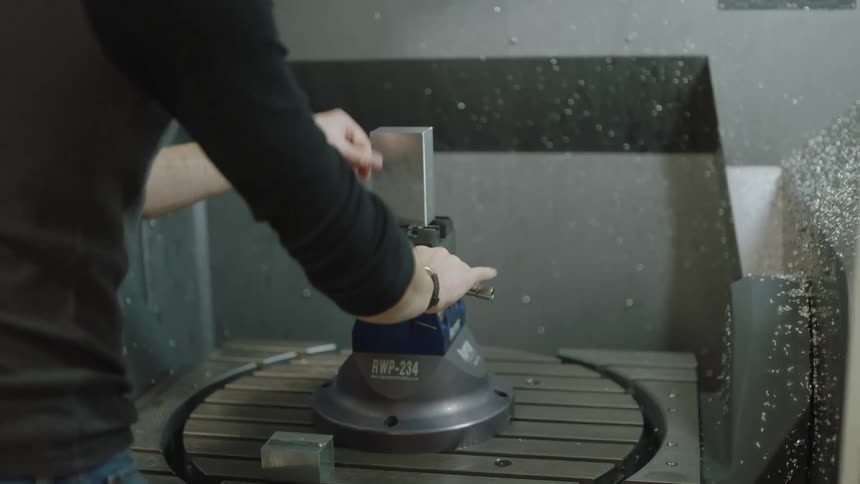 A person is adjusting the machine