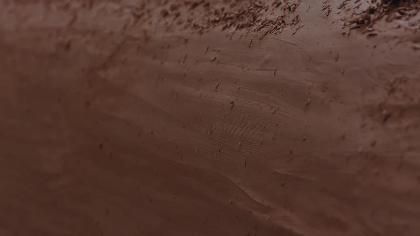 Side of clay model with shavings