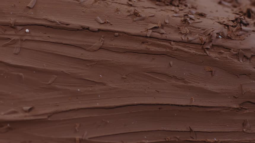 The camera pans left as it captures details of a textured surface