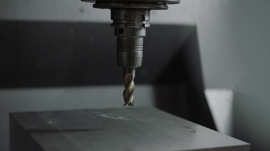 The drills lowers to the object