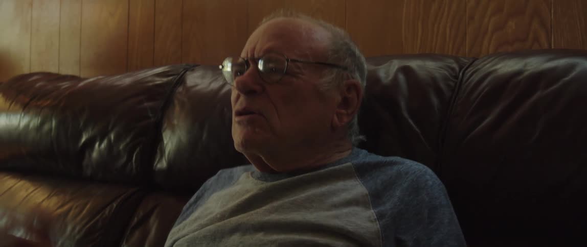 A man is yelling at something he is watching