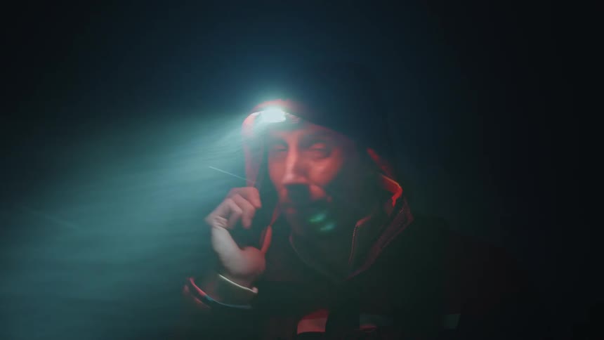 A man talks on his cell phone at night