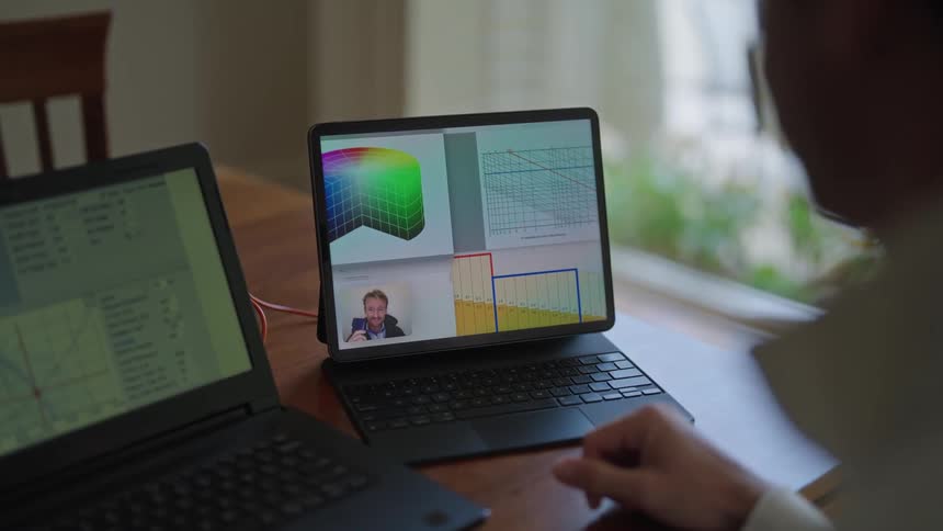 Two men talk on a video call