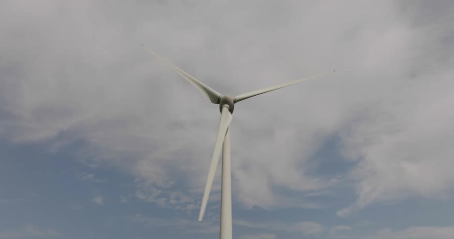 The blades of wind turbine under the daytime sky