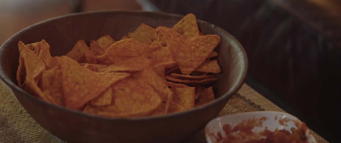 A bowl of doritos is full