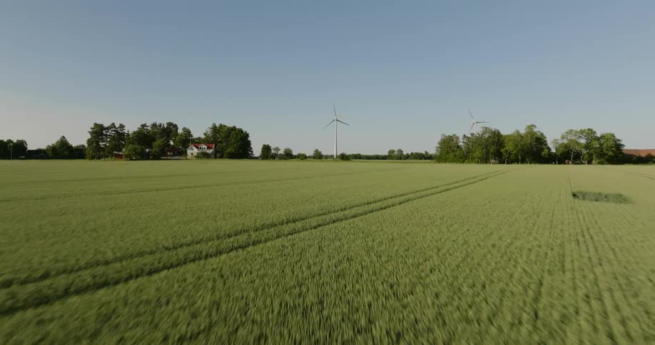 The windmills are past the farmland