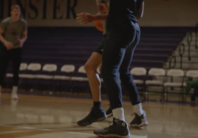 A man passes the ball and a shot is made
