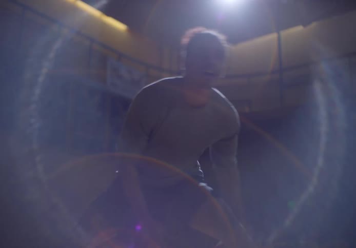 A man is dribbling a basketball