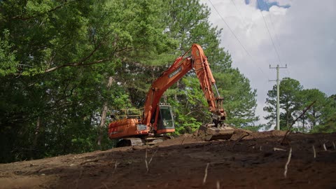 The excavator is moving dirt
