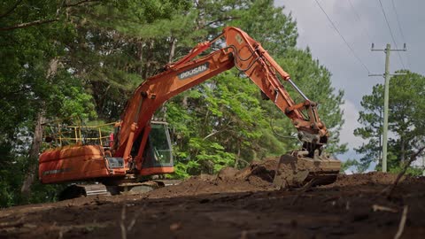 The excavator is digging up dirt