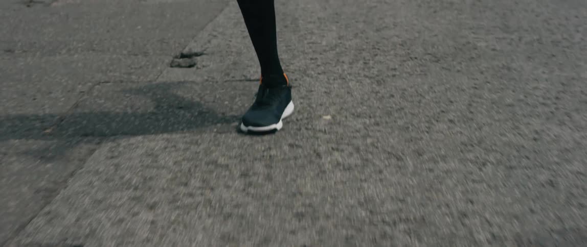 A person is running down the road