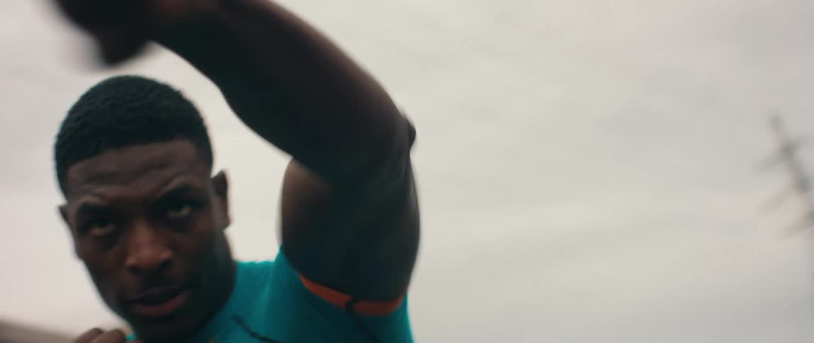 Black man shadowboxing outdoors