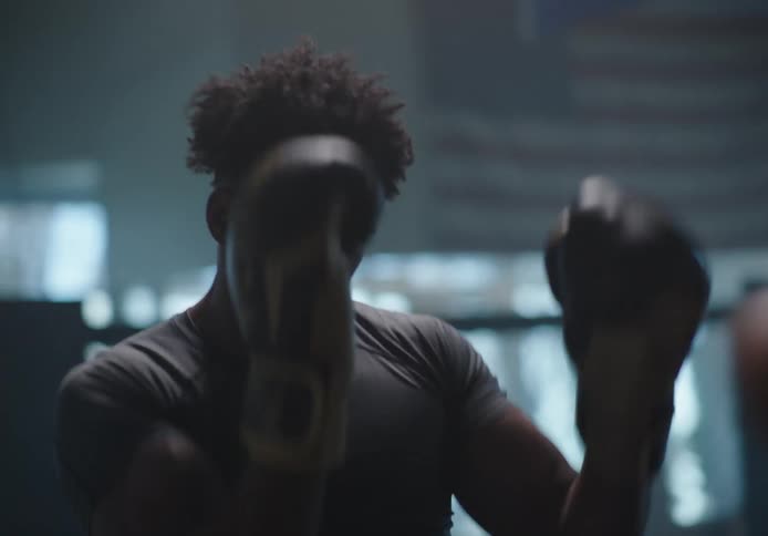 Two men are boxing in the ring