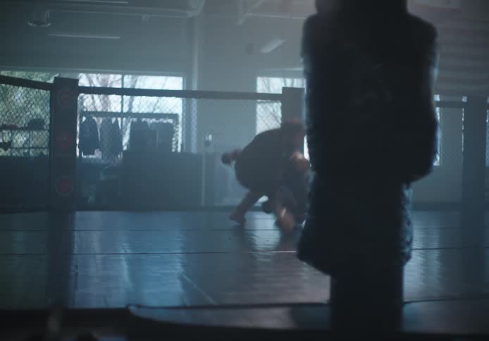 Two men are fighting in the ring