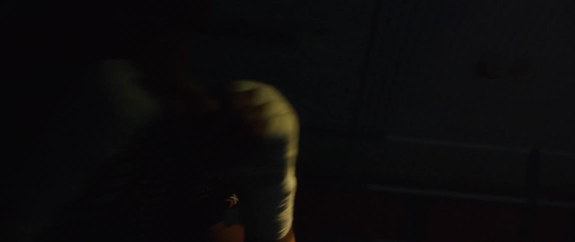Black man shadowboxing indoors