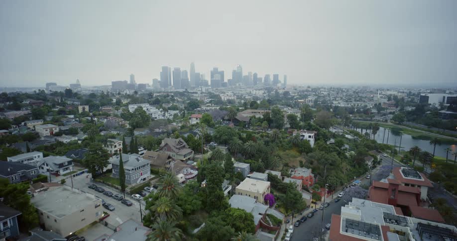 Aerial shot traveling through many neighborhoods in a city