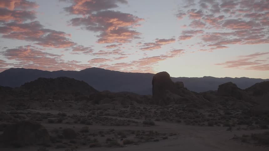 A beautiful sky can be seen above an arid desert landscape