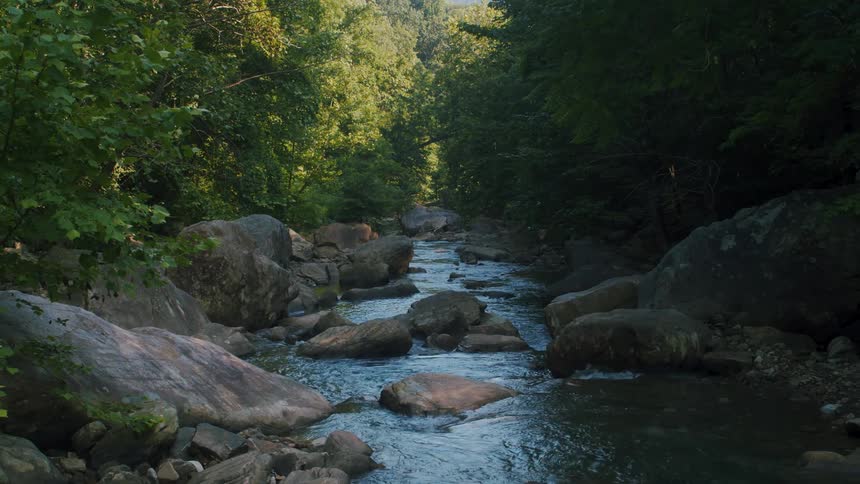 A river in the wilderness strewn with rocks and boulders