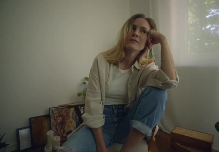 A woman is sitting in a chair