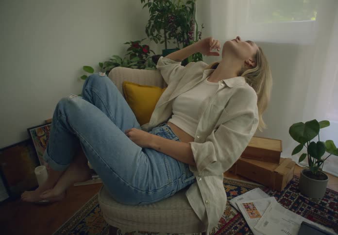 A woman relaxes in the chair