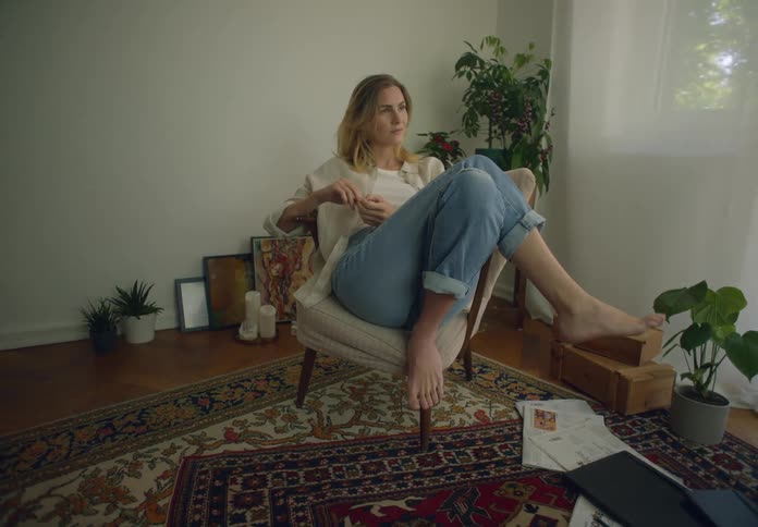 A woman is relaxing at home