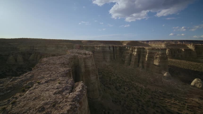 Ascending the edge of a beautifully contoured and sculpted rock formation