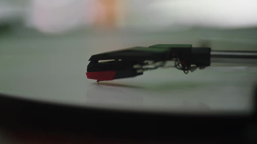 Vinyl record spinning on a record player indoors