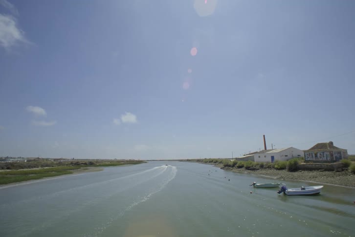 Aerial view of river and boats lying at anchor