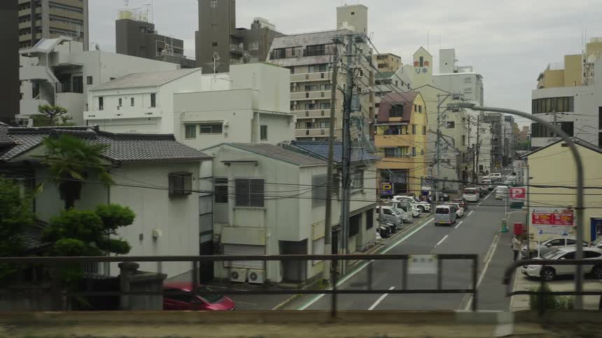 Traffic runs through a Japanese city