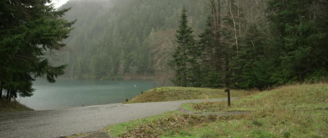 A rural road that runs along a lakeside